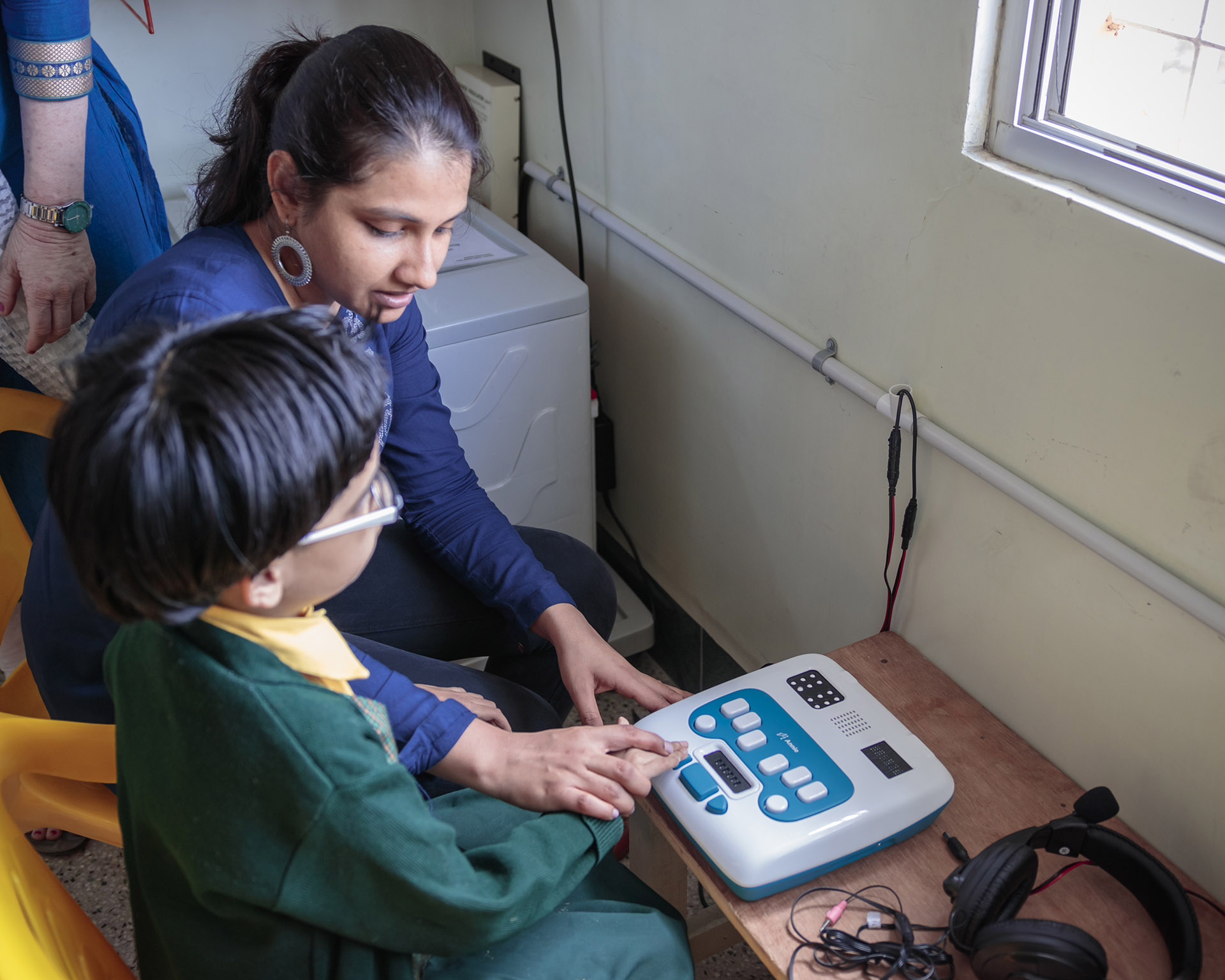 Learner being assisted by a teacher on Annie